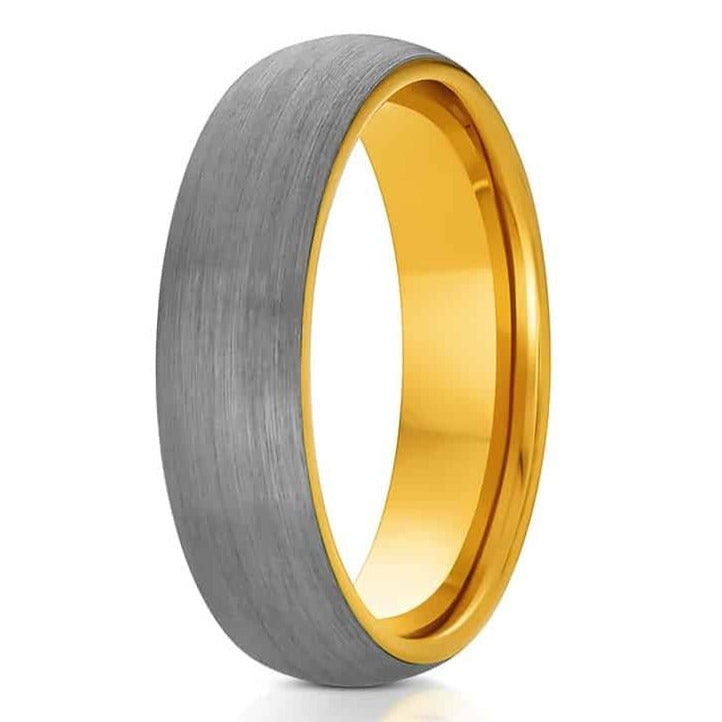 The Charlemagne, a gray and gold tungsten carbide ring with a brushed finish and a gold polished band.