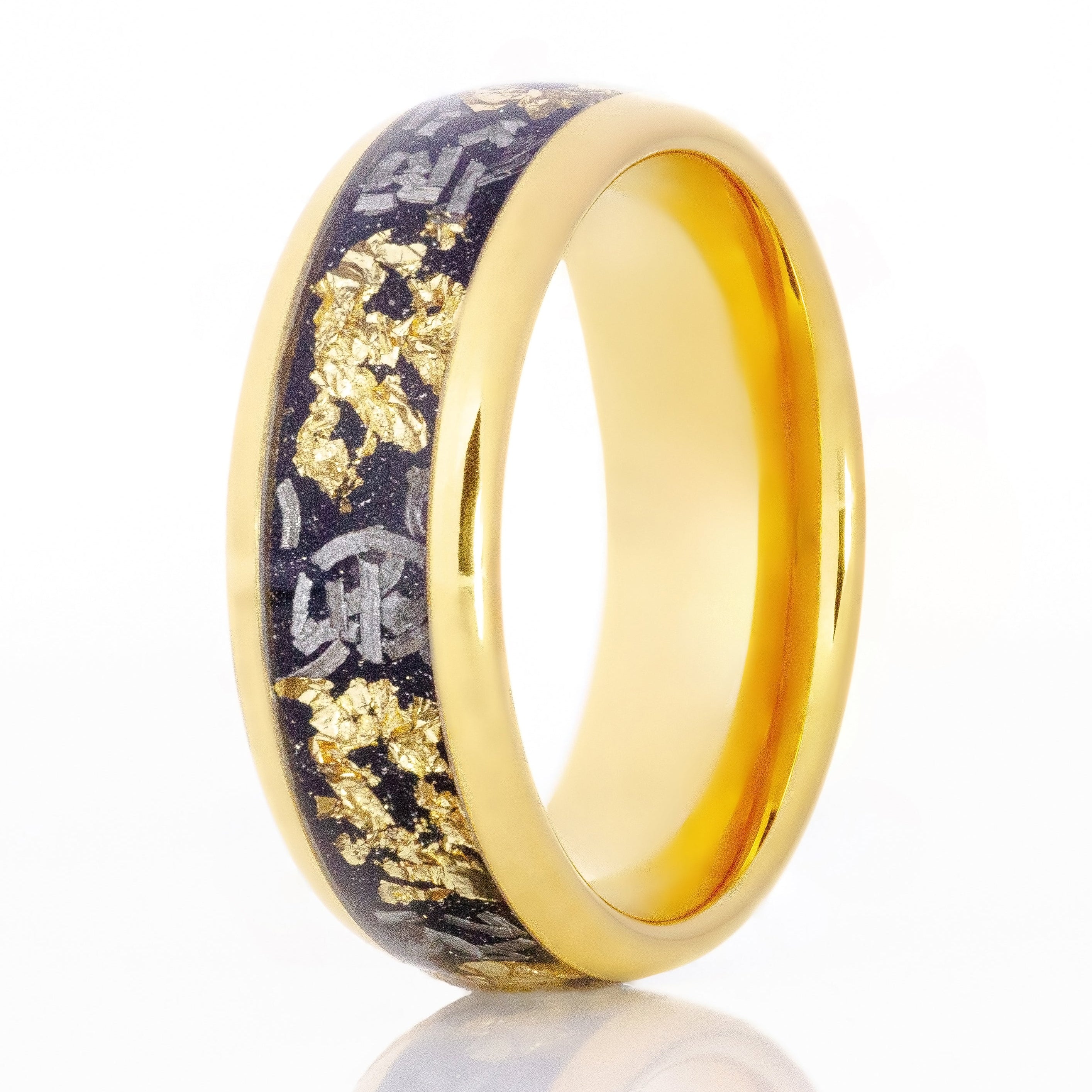 The Emphasis, a 6mm gold tungsten ring with a polished finish that features a black inlay with gold flakes and meteorite.