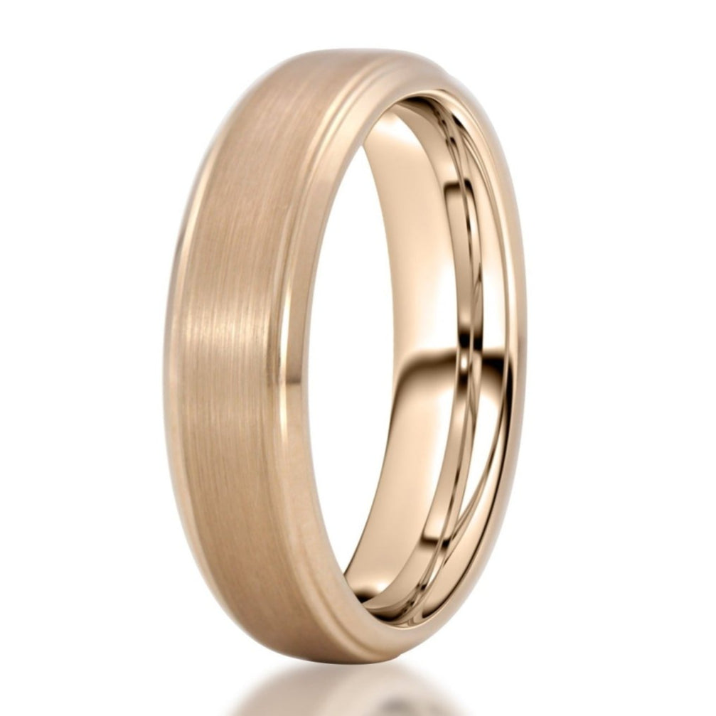 The Margaret, a 6mm rose gold tungsten ring that features a brushed finish center with sleek, polished beveled edges.