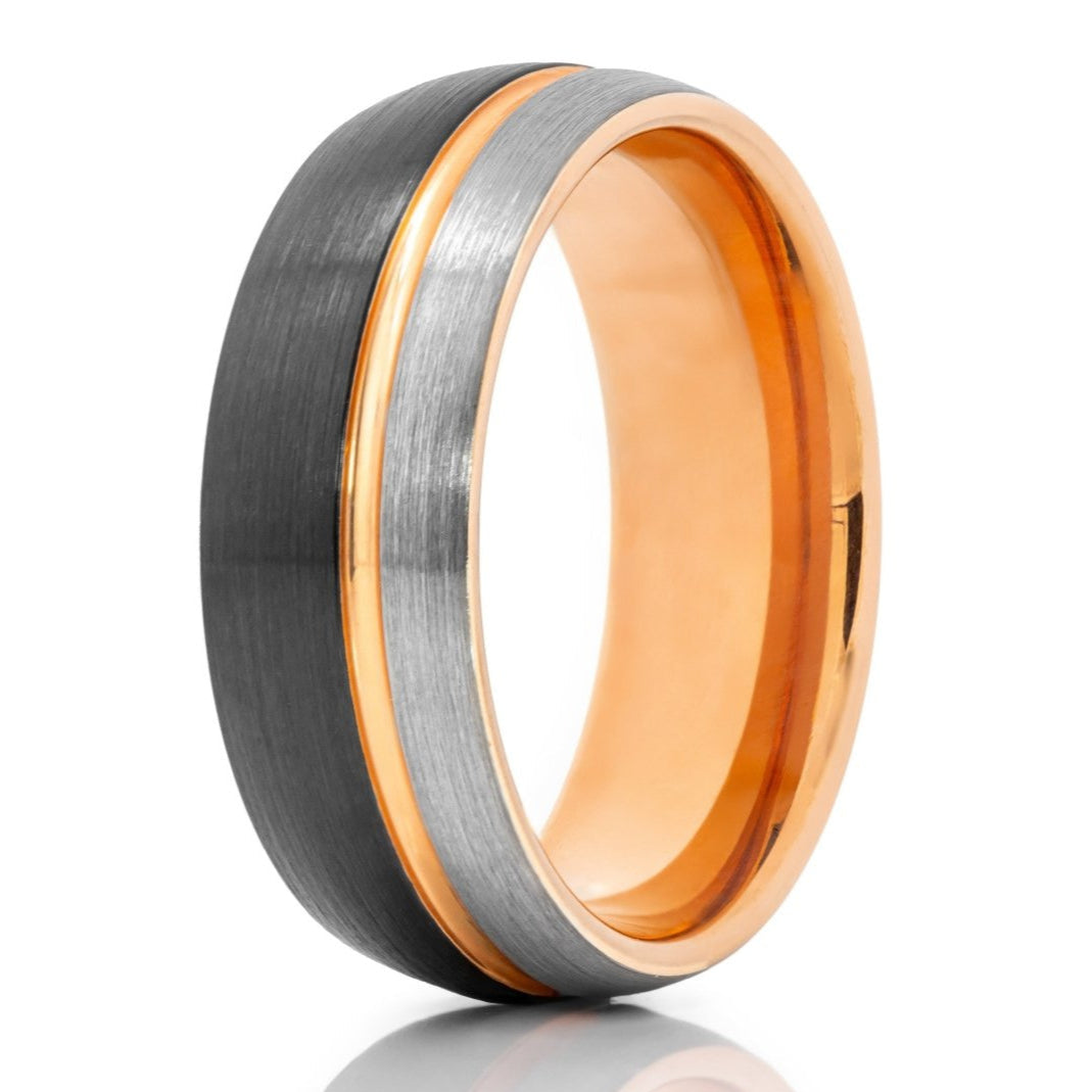The Stang, a black and silver two-tone front face with a brushed finish and rose gold polished groove and inner band.