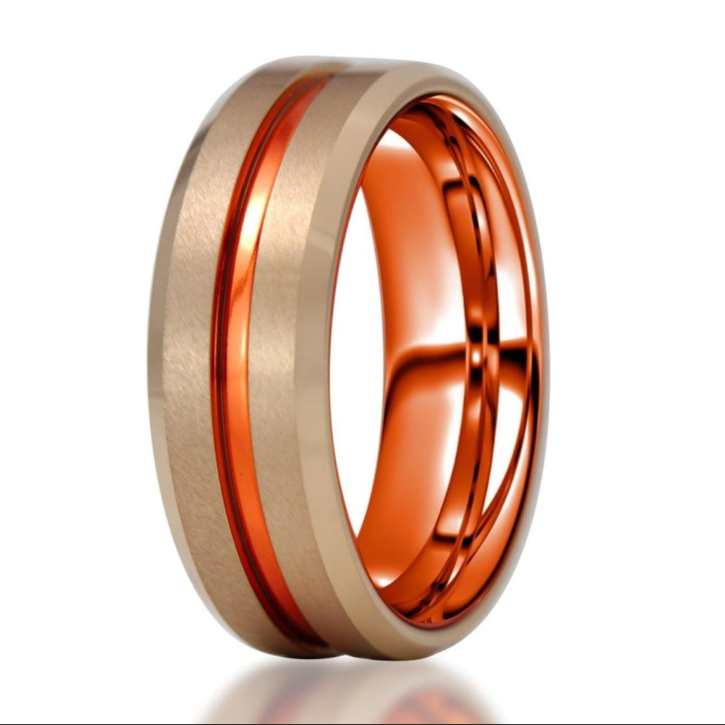 The Tycoon, a rose gold tungsten ring with a brushed center and polished groove and edges with a red alumnium center groove and inner sleeve.