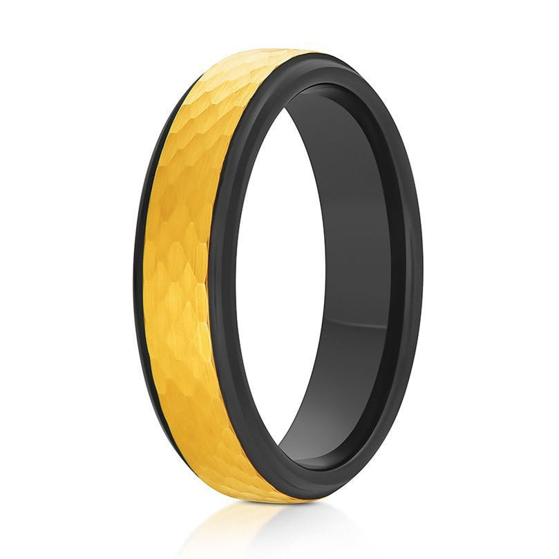 The Underworld, a black and gold tungsten carbide ring with a gold, hammered and brushed center with black, polished edges and band.