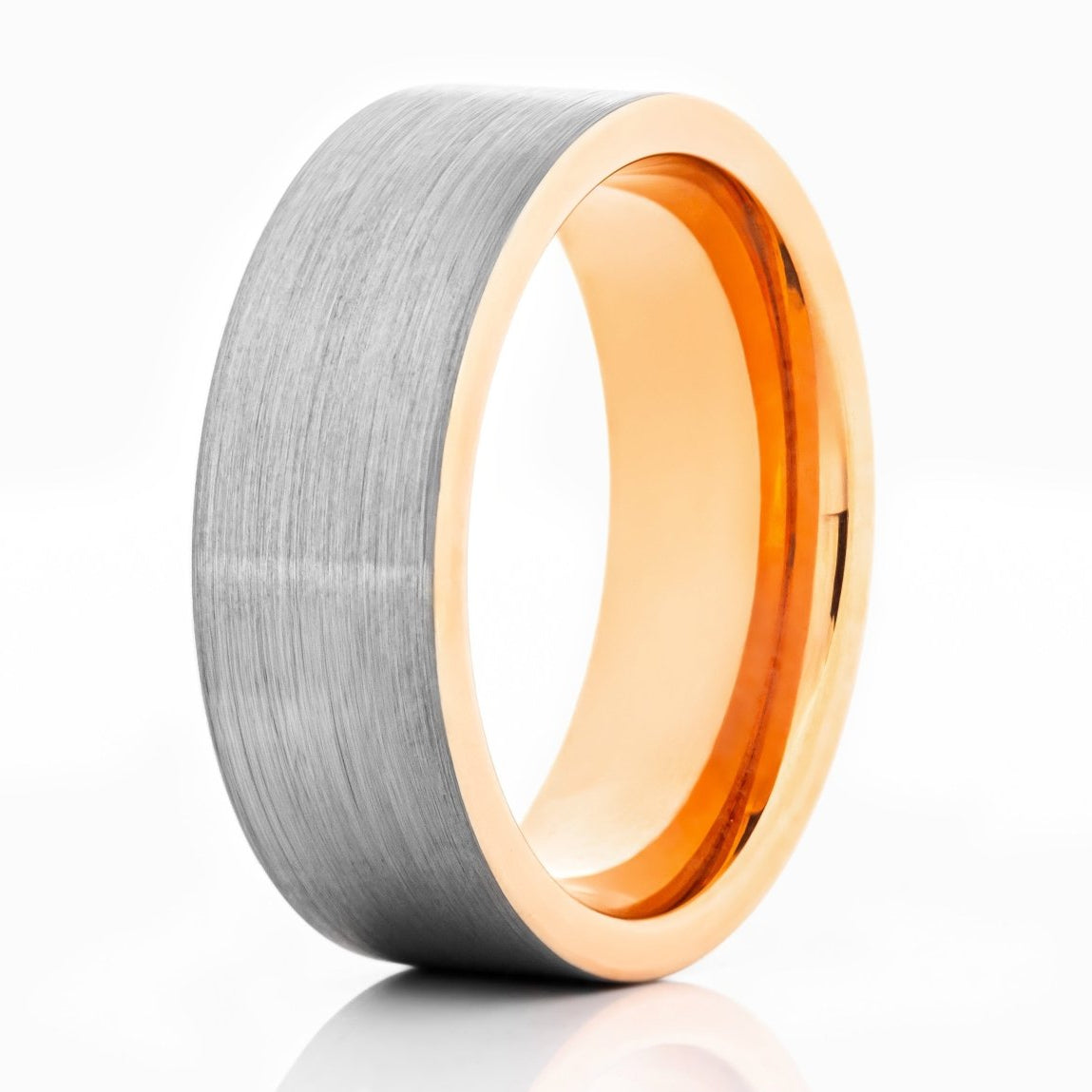 The Woolly, a silver tungsten ring with a brushed finish and pipe cut design that features a rose gold polished band and edges.