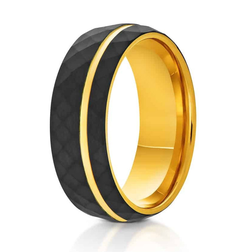The Denali, a black tungsten carbide ring that features a hammered and brushed finish and a polished gold groove and inner band.