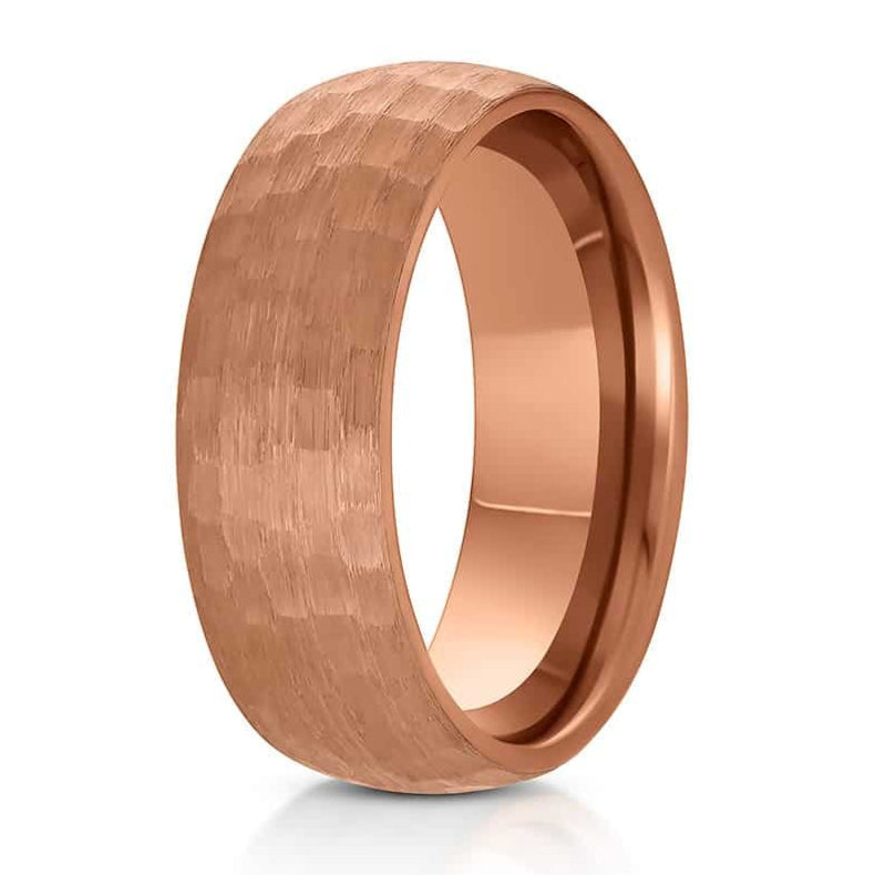 The Robinson, a rose gold tungsten carbide ring that features a hammered and brushed finish and a sleek, polished band.