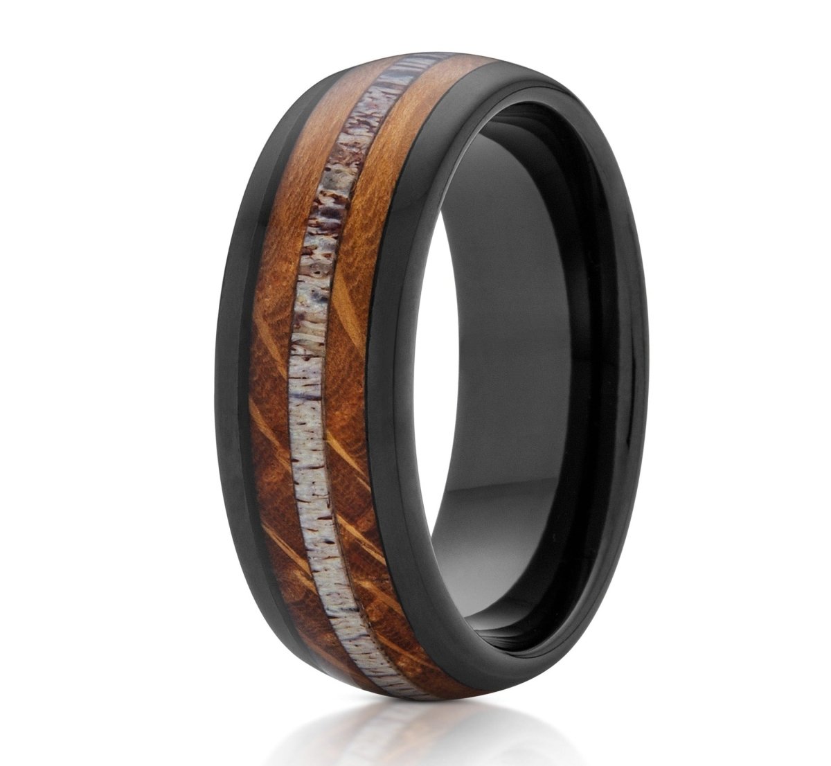 The Back Woods, a black tungsten carbide ring with a polished finish that features a whiskey barrel wood and deer antler inlay.