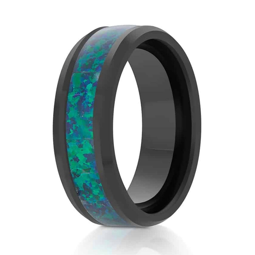 The Basalt, a black tungsten ring that features a polished finish and emerald green opal inlay.