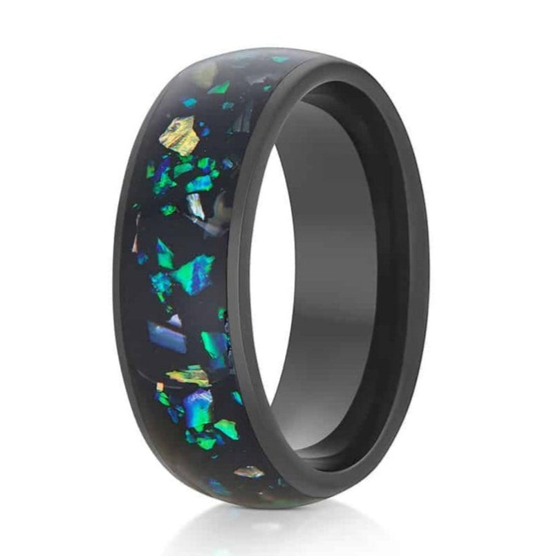 The Cerise, a 8mm black tungsten carbide ring with a polished finish that features an opal and abalone fragments inlay in the center.