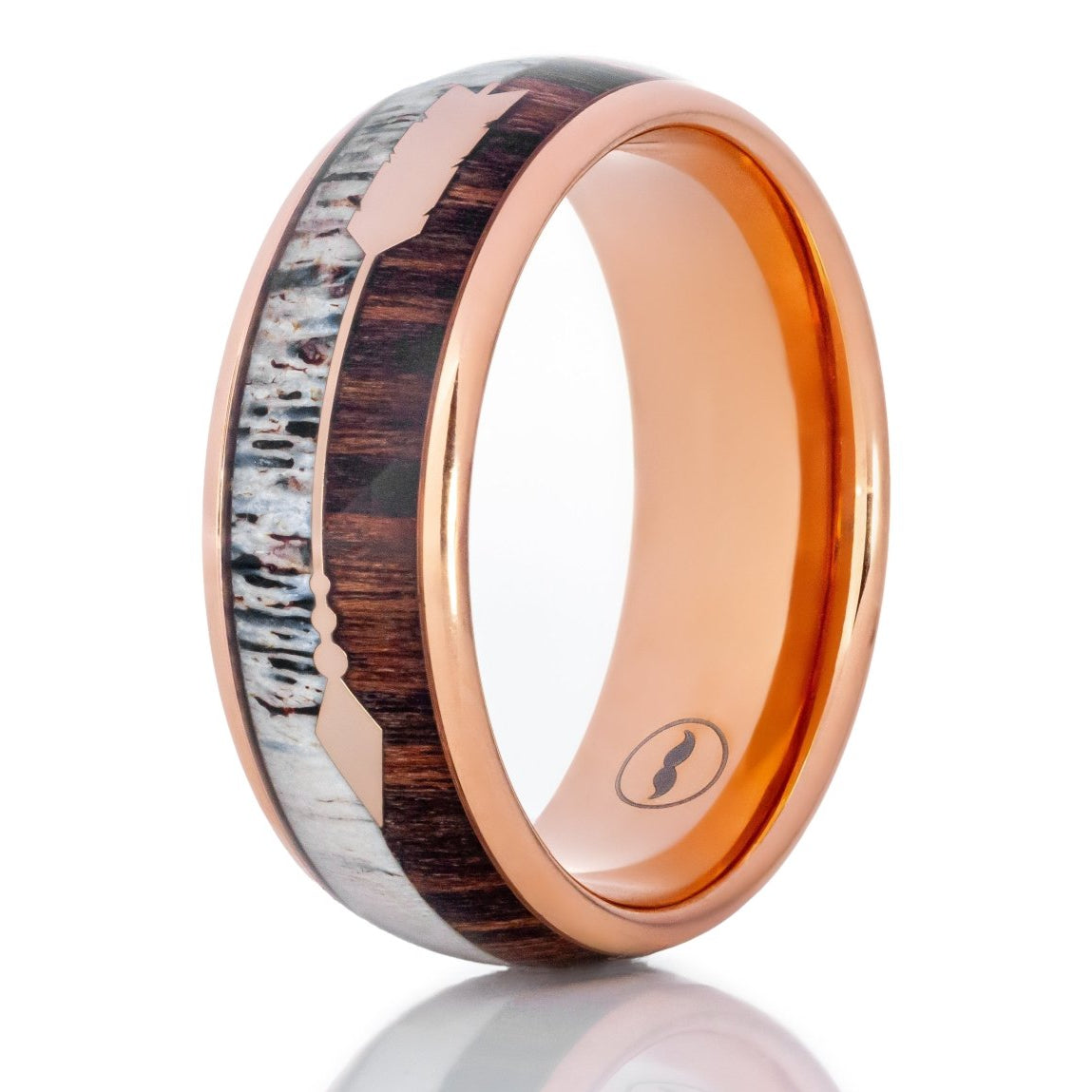 The Ragnar, a 8mm rose gold tungsten ring with a Koa wood and deer antler inlay with a rose gold feathered arrow in the center.