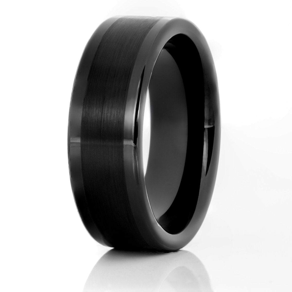 The Rider, a black tungsten carbide ring with a brushed center and polished edges.