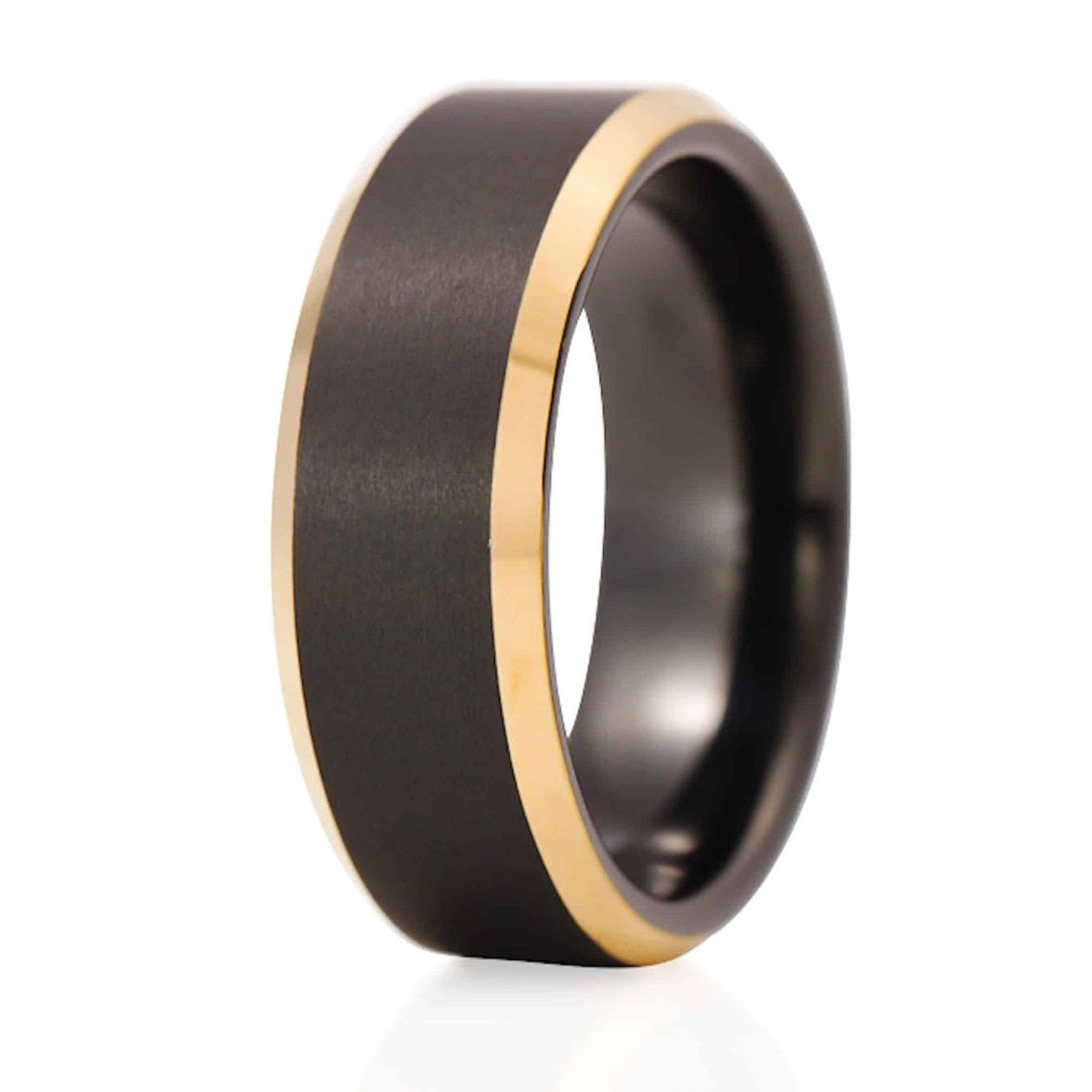The Rio, a black tungsten carbide ring that features a brushed center and gold, sleek, polished edges.