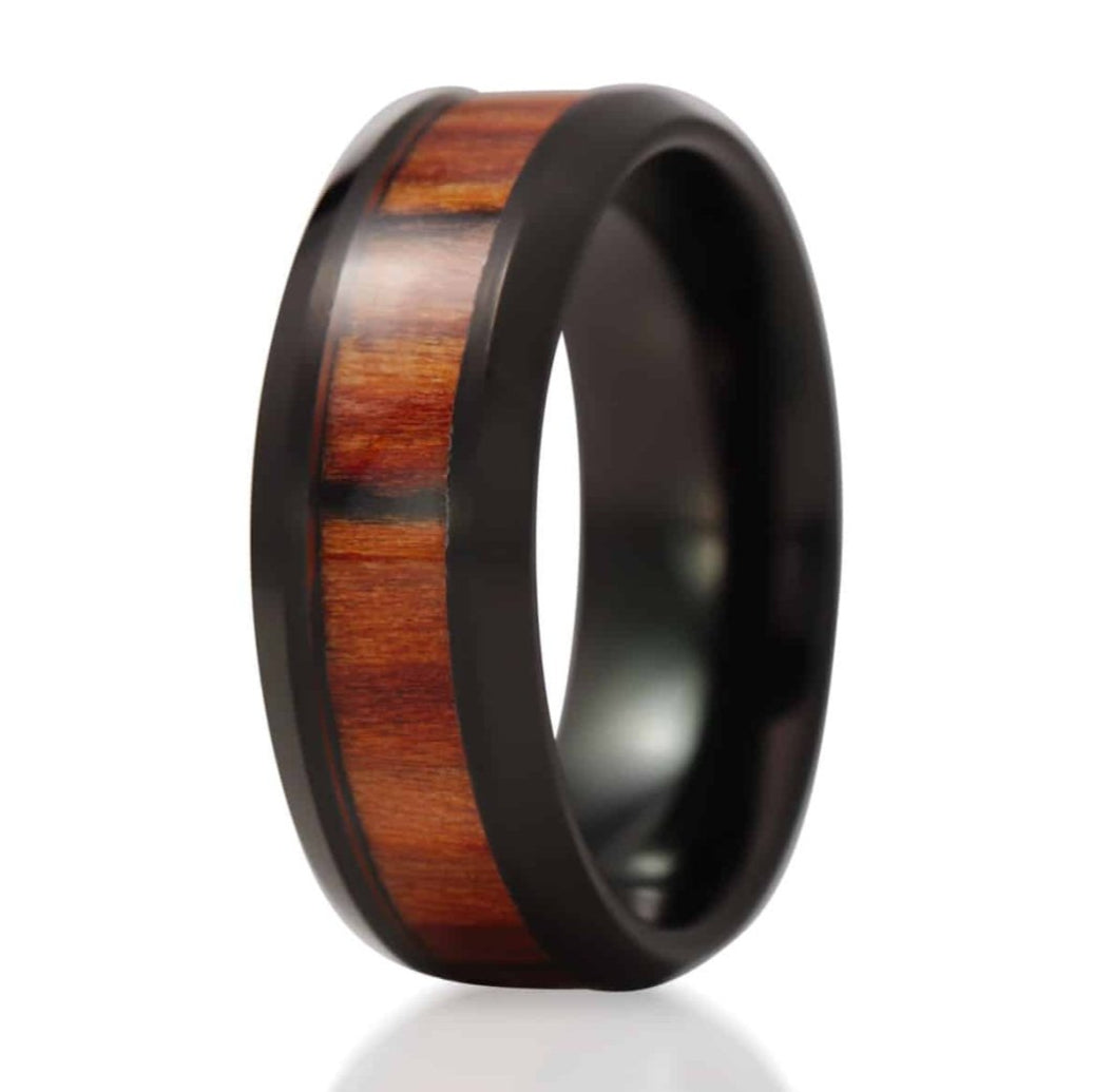 The Silverton, a black tungsten carbide ring that features a polished finish and a dark mahogany wood inlay.