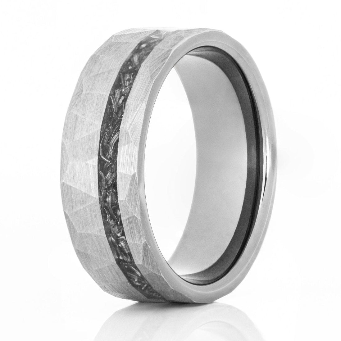 The Stargazer, a silver tungsten ring with a hammered and brushed finish that features a meteorite inlay.