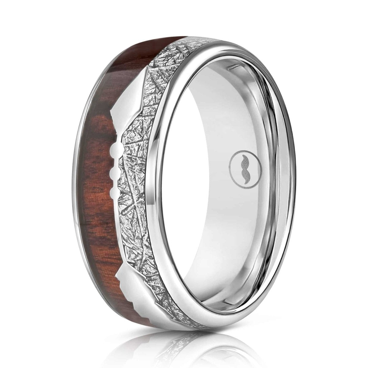 The Apollo, a silver tungsten scratch resistant carbide wedding band with a polished finish that features a hawaiian koa wood and a meteorite inlay with a center arrow design.