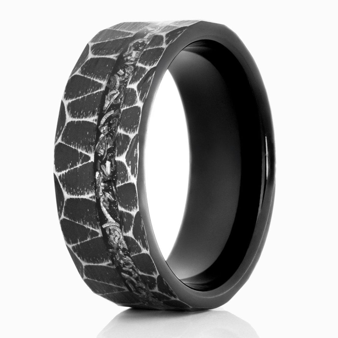 The Astronaut, a black tungsten carbide scratch resistant ring with a hammered and brushed finish that features a meteorite inlay.