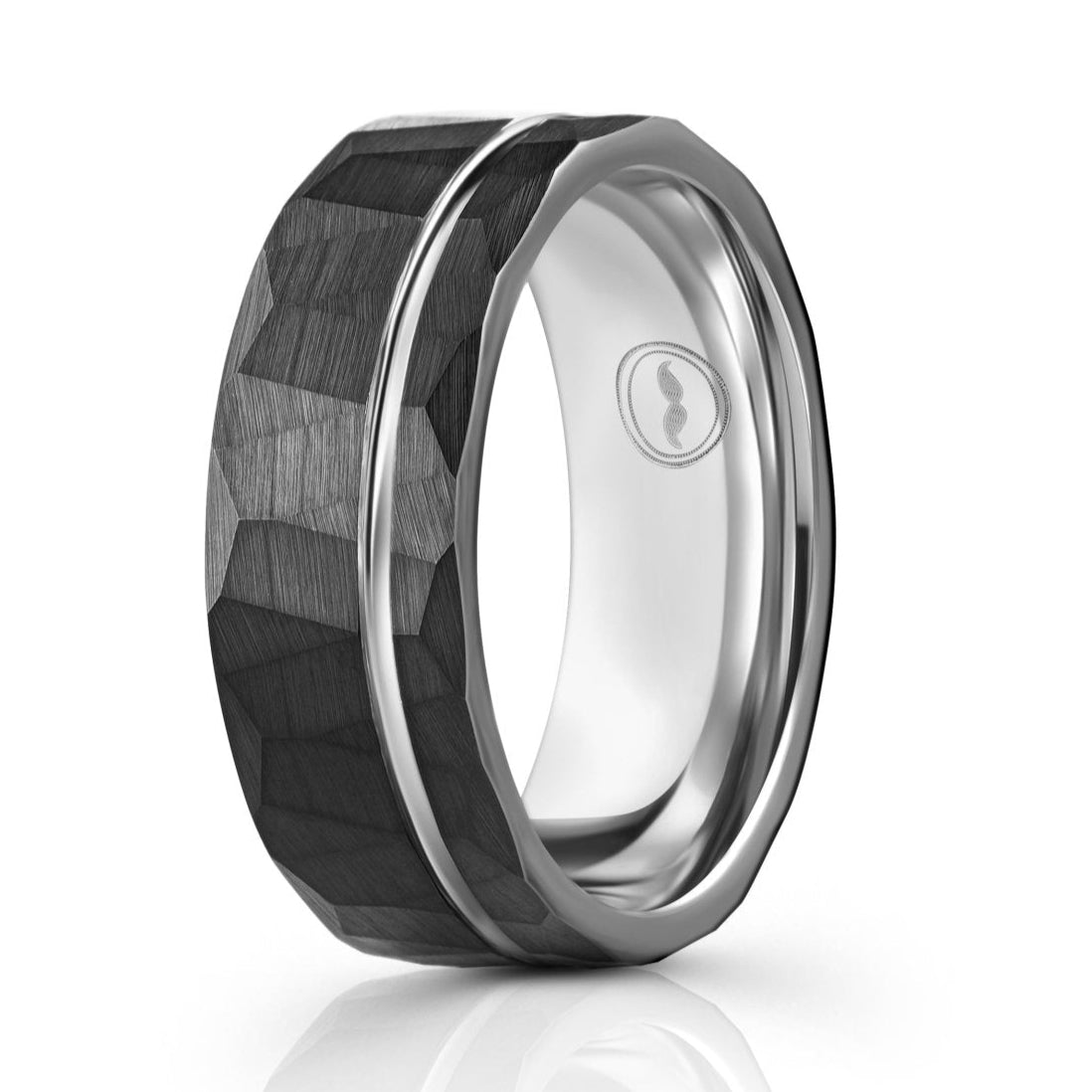 The Blade, a black tungsten carbide scratch resistant ring that features a hammered and brushed finish a polished silver groove and band.