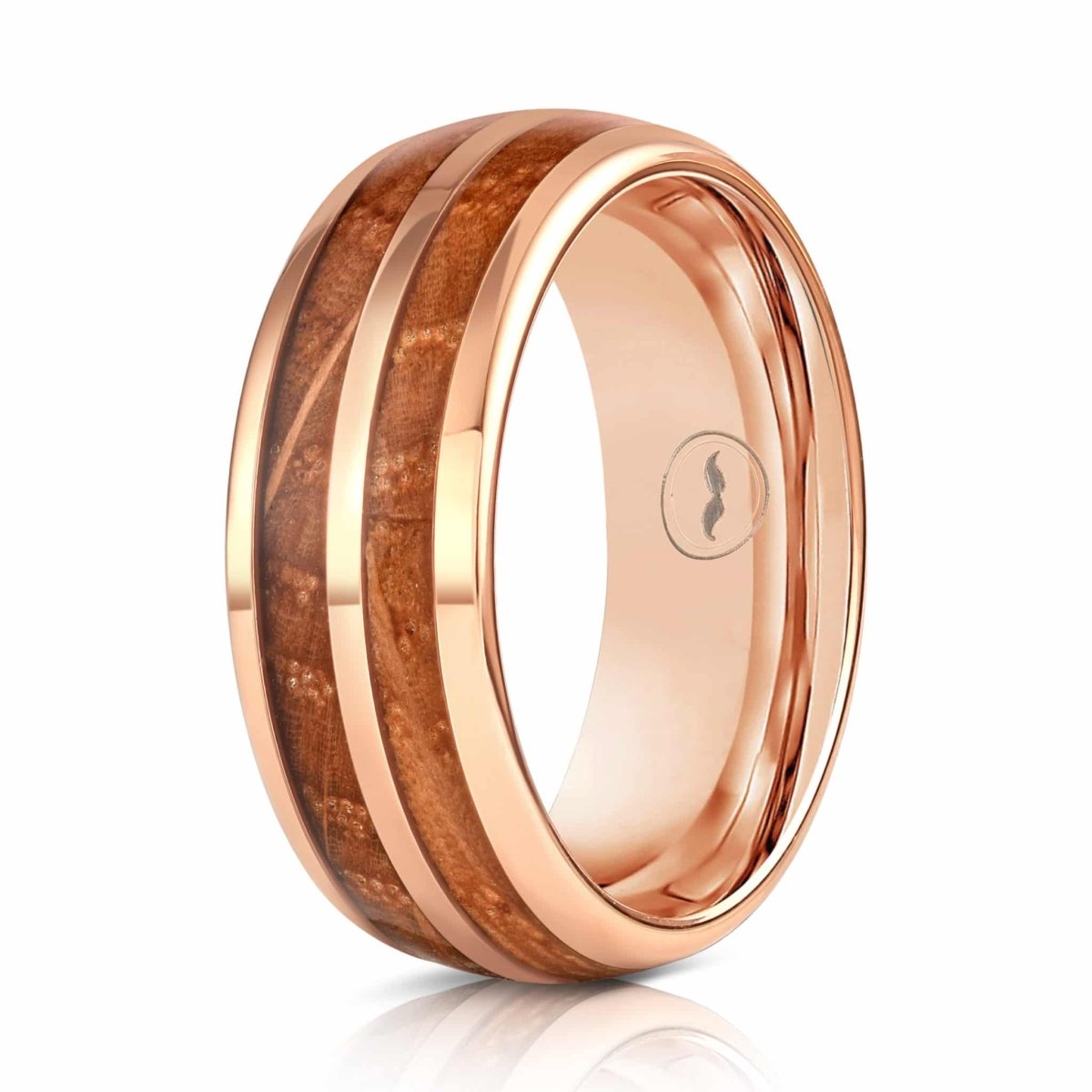 The Distiller, a rose gold tungsten carbide scratch resistant ring that features a double whiskey barrel wood inlay with a polished finish.