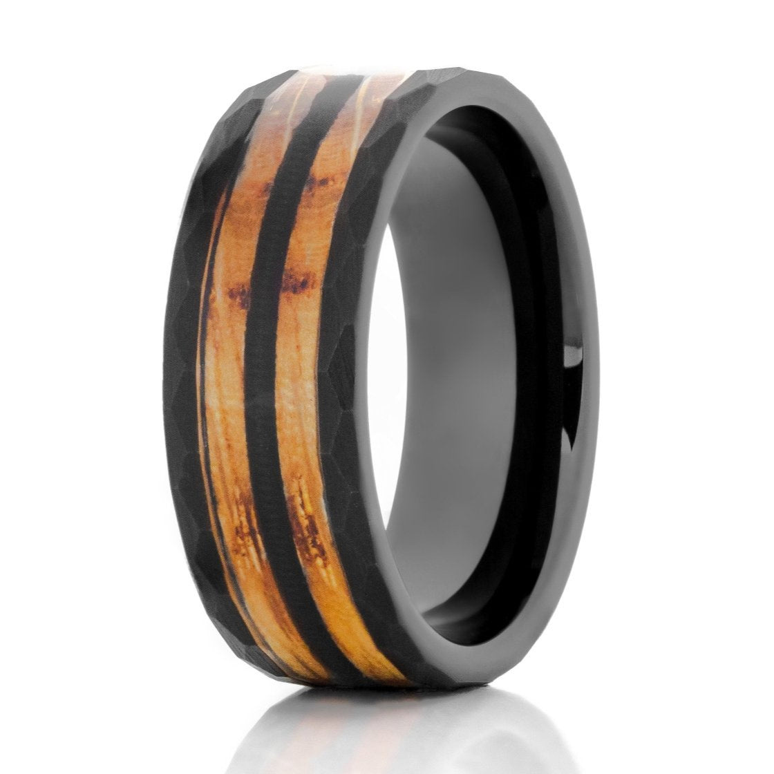 The Musician, a black tungsten carbide ring that features a hammered and brushed finish paired with a charred whiskey barrel wood and guitar string inlay.