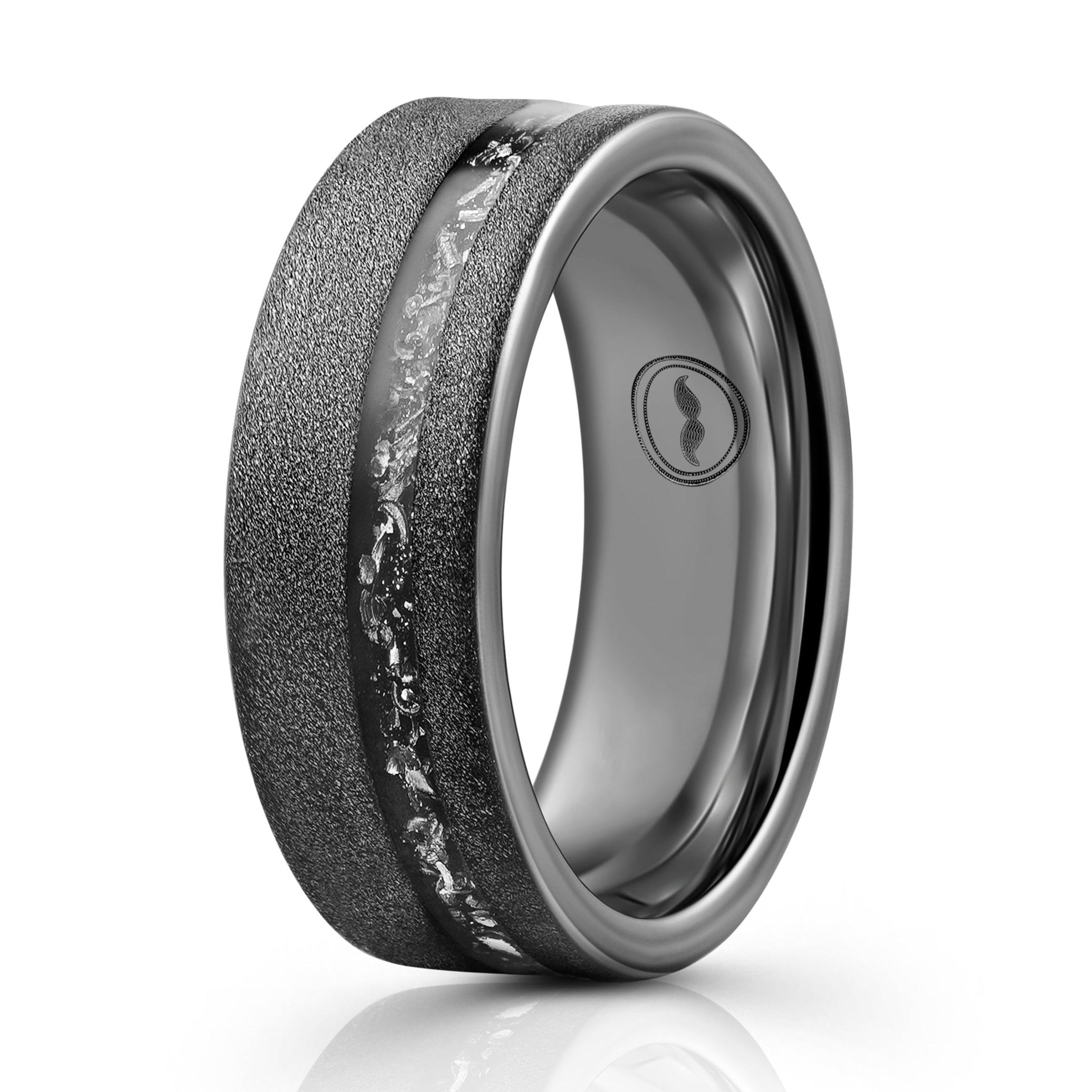 The Swagger, a black and gray tungsten carbide ring that features a sandblasted finish that gives it a unique look paired with a meteorite inlay.