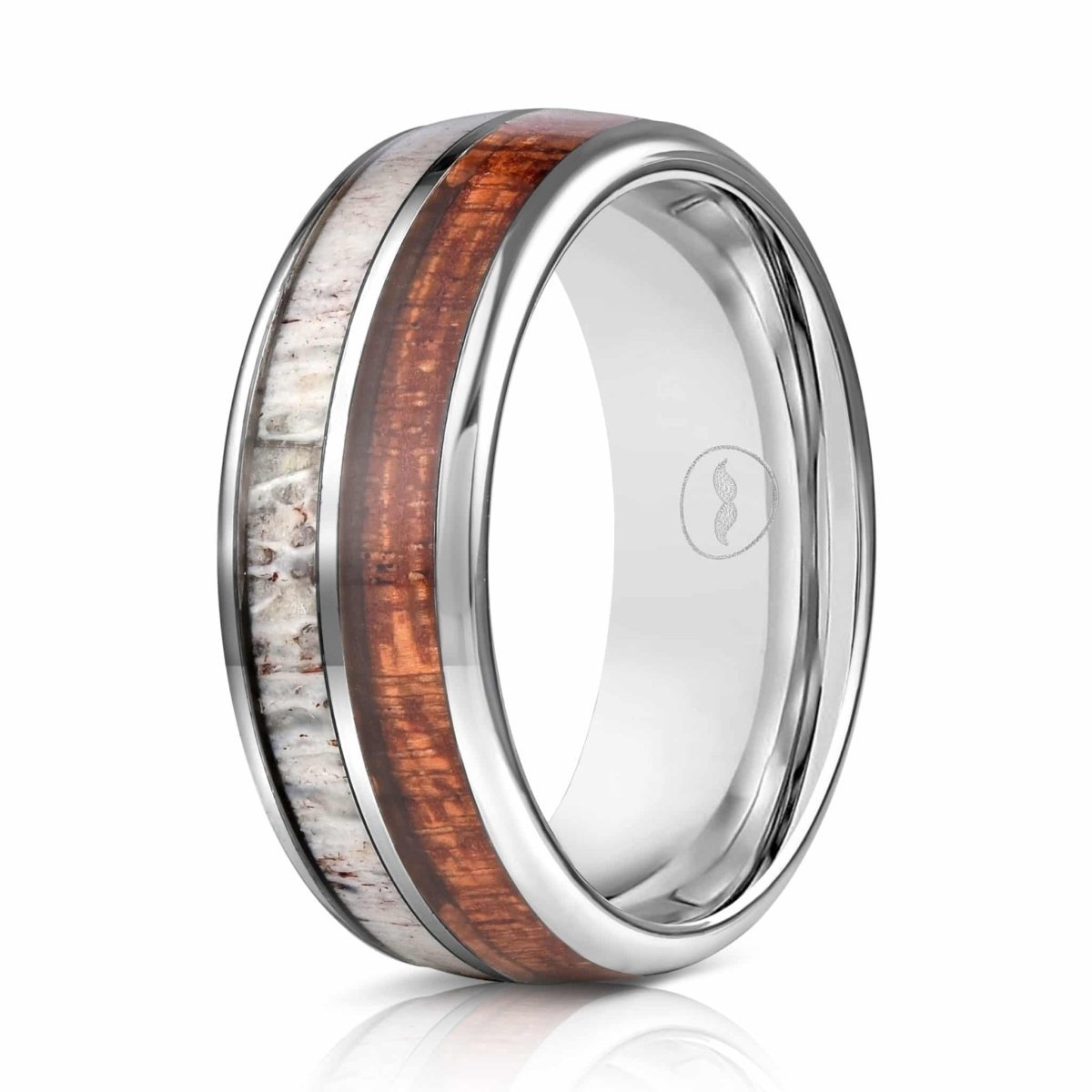 The Whitetail, a silver tungsten carbide scratch resistant wedding band that features a Hawaiian koa wood inlay paired with a deer antler inlay.