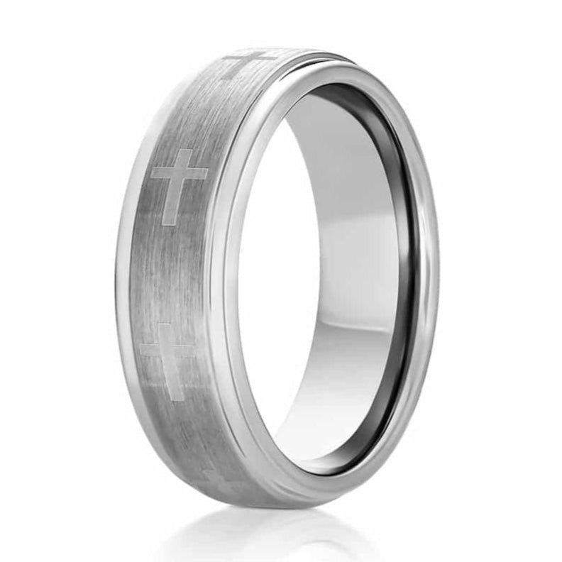 The Cross, a silver tungsten carbide scratch resistant wedding or engagement ring with a brushed center and polished edges features laser engraved crosses, on a white background.