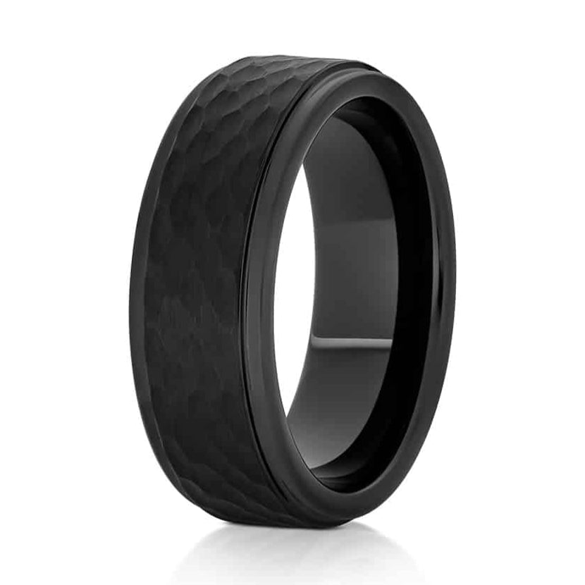 The Forge, a 8mm black tungsten carbide ring that features a hammered and brushed center with sleek, polished edges and band.