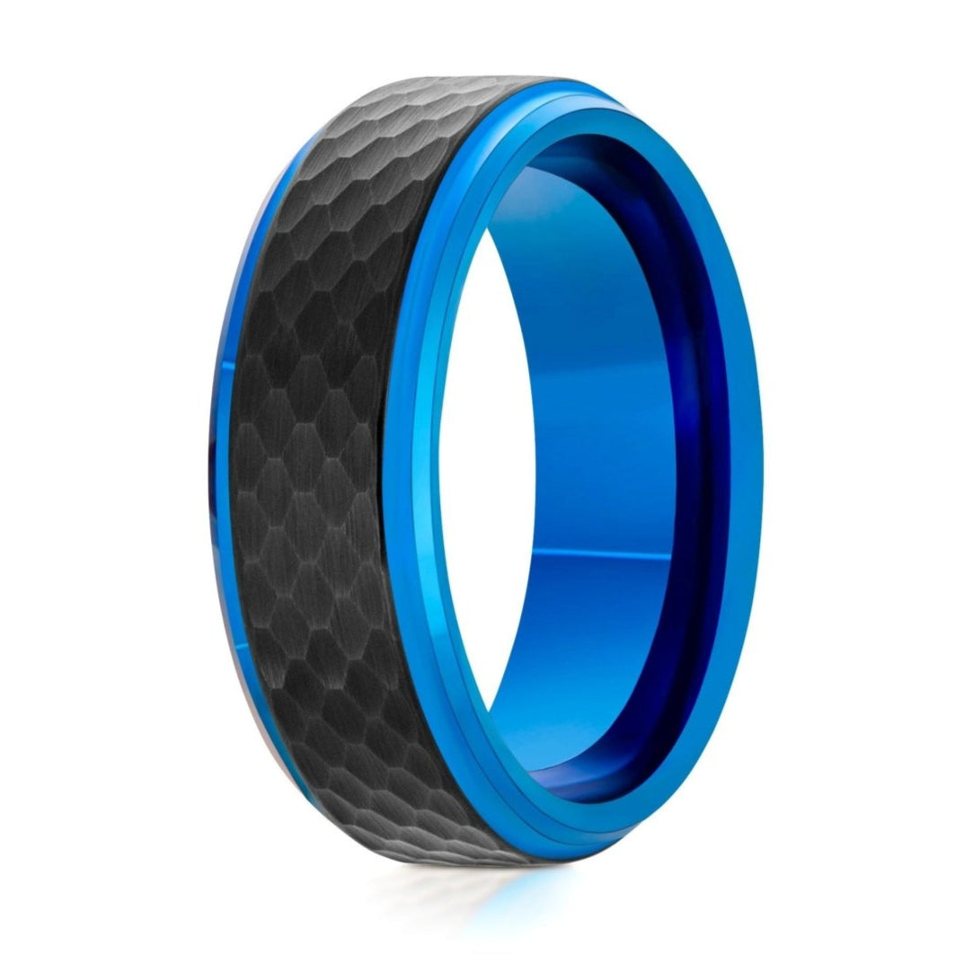 The Galaxy, a 8mm black and blue tungsten carbide ring that features a hammered and brushed black center and polished blue edges and band.