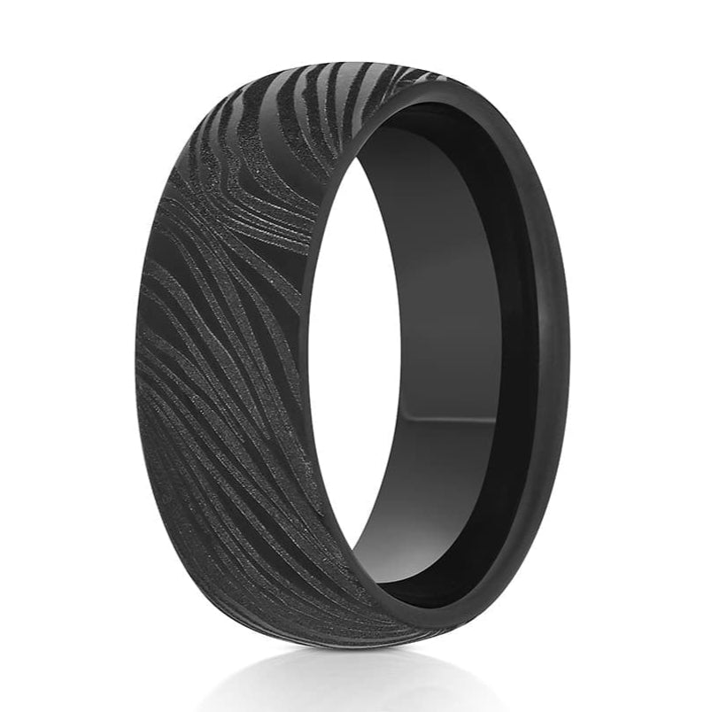 The Lucky, a 8mm black tungsten ring with a carved design that gives it a textured finish.