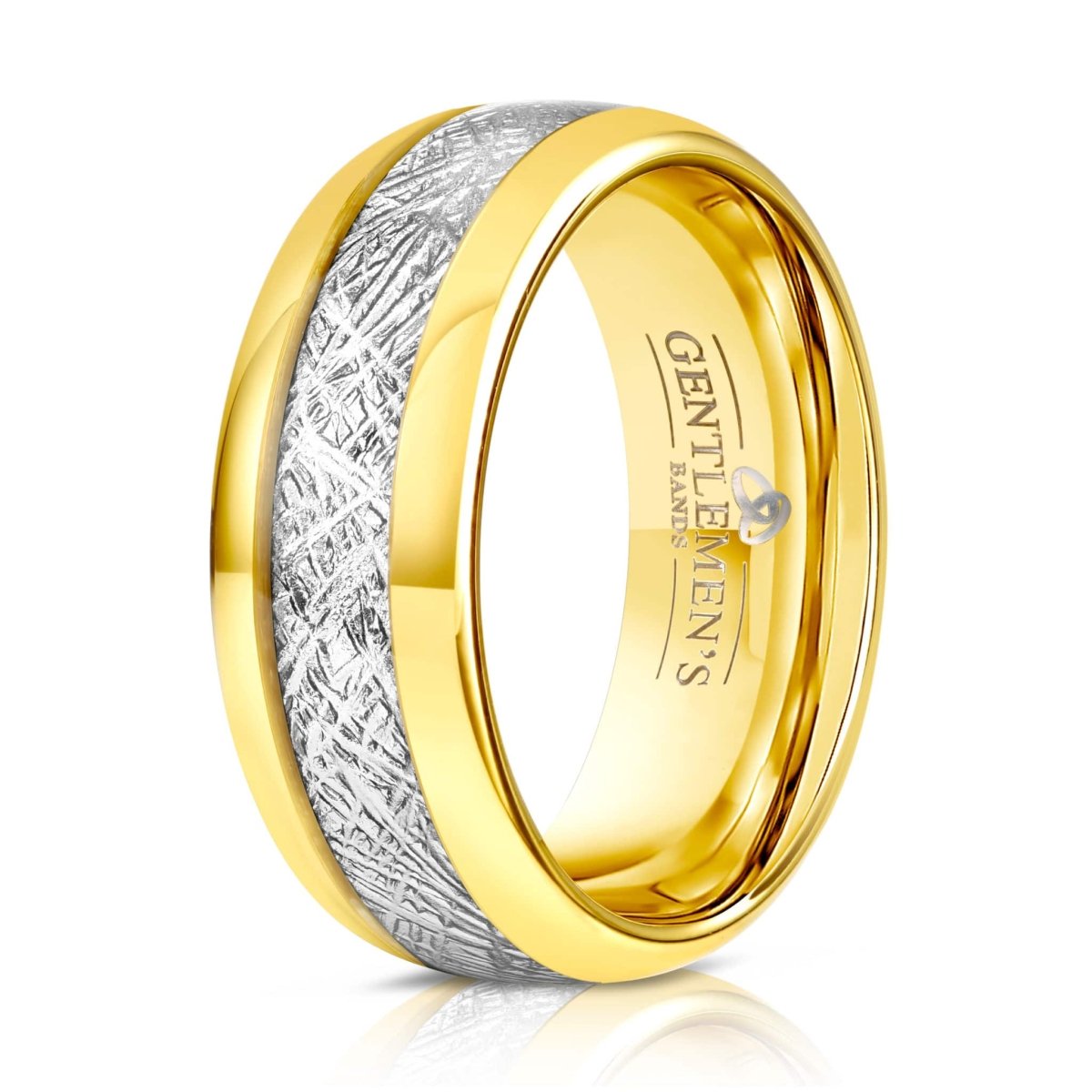The Meteor, a gold and silver wedding band that includes a meteorite inlay and features a bold polished finish.