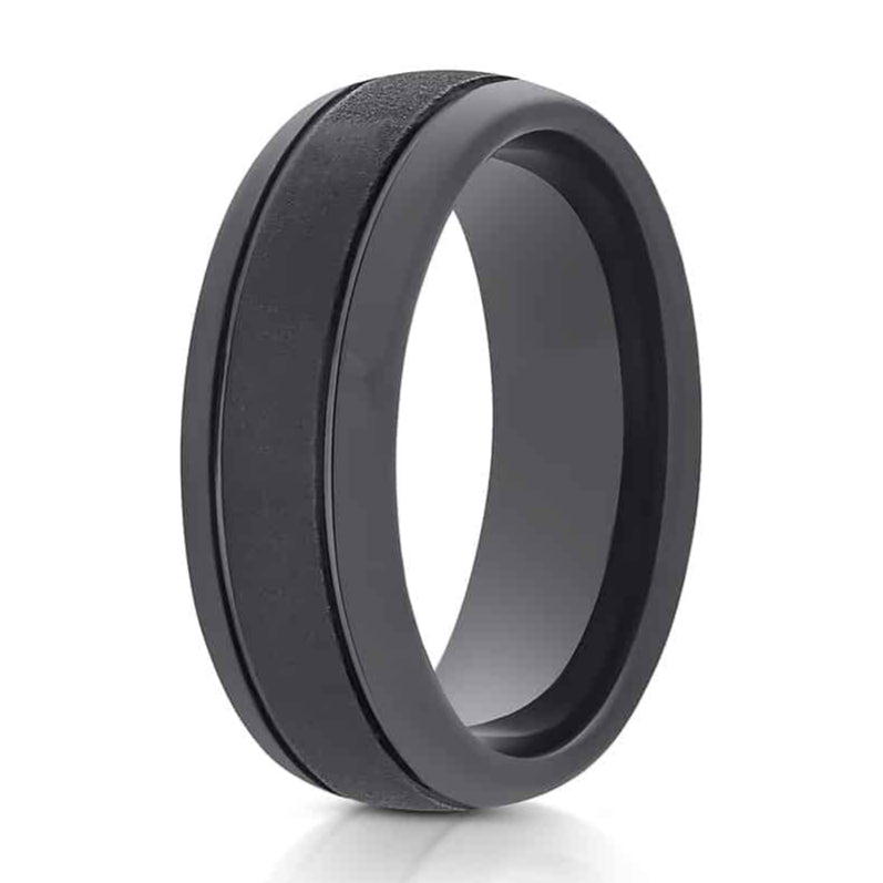 The Panther, a 8mm black tungsten carbide ring with a sandstone center and sleek, polished edges and inner band.