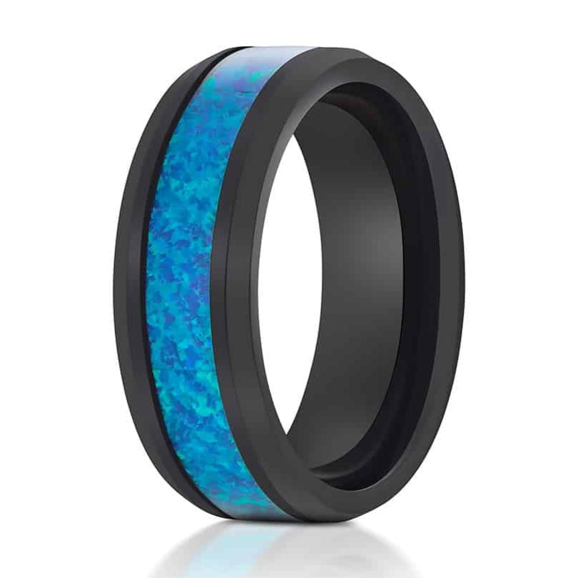 The Pitcher, a black 8mm tungsten ring with a sleek, polished finish features a blue opal inlay.