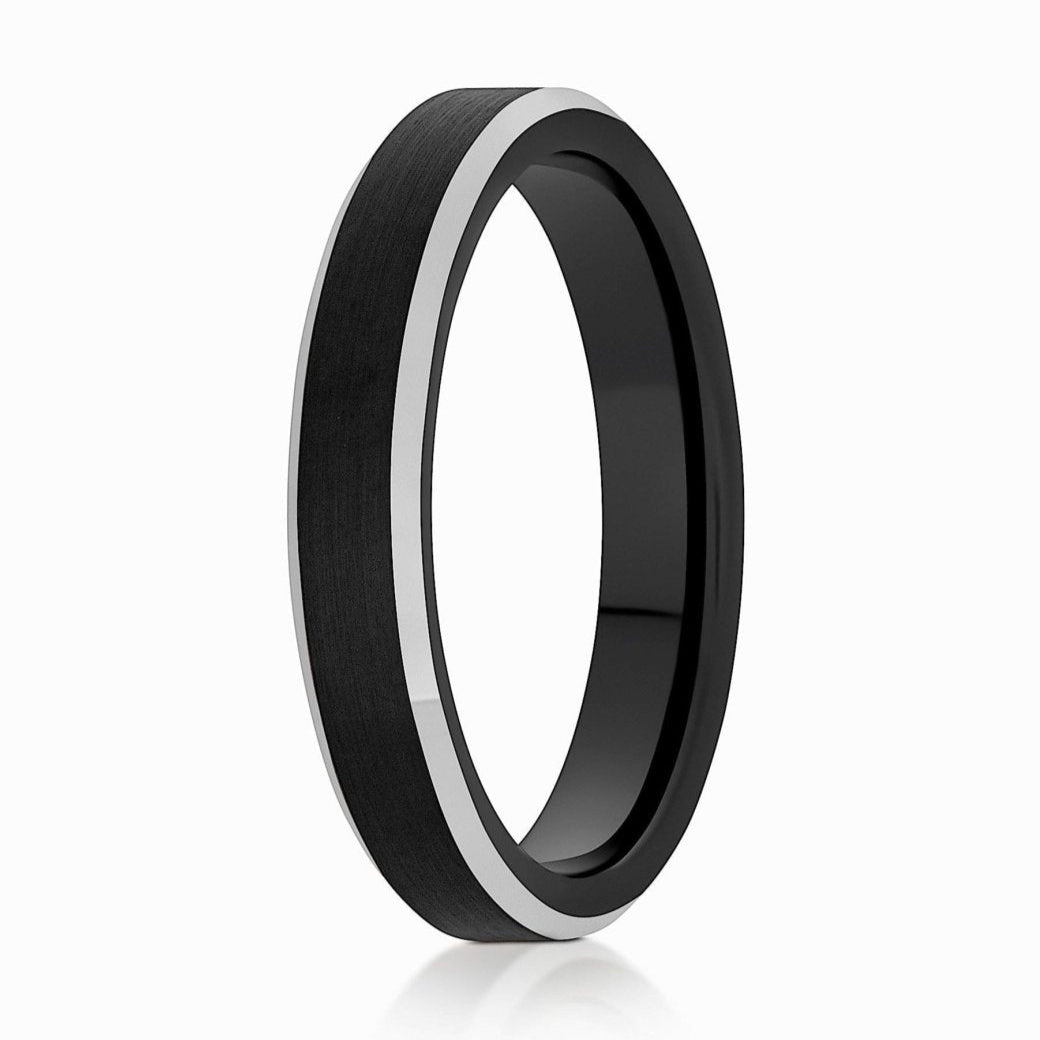 The Poppy, a black 4mm tungsten carbide ring with a brushed finish that features sleek, silver polished edges.