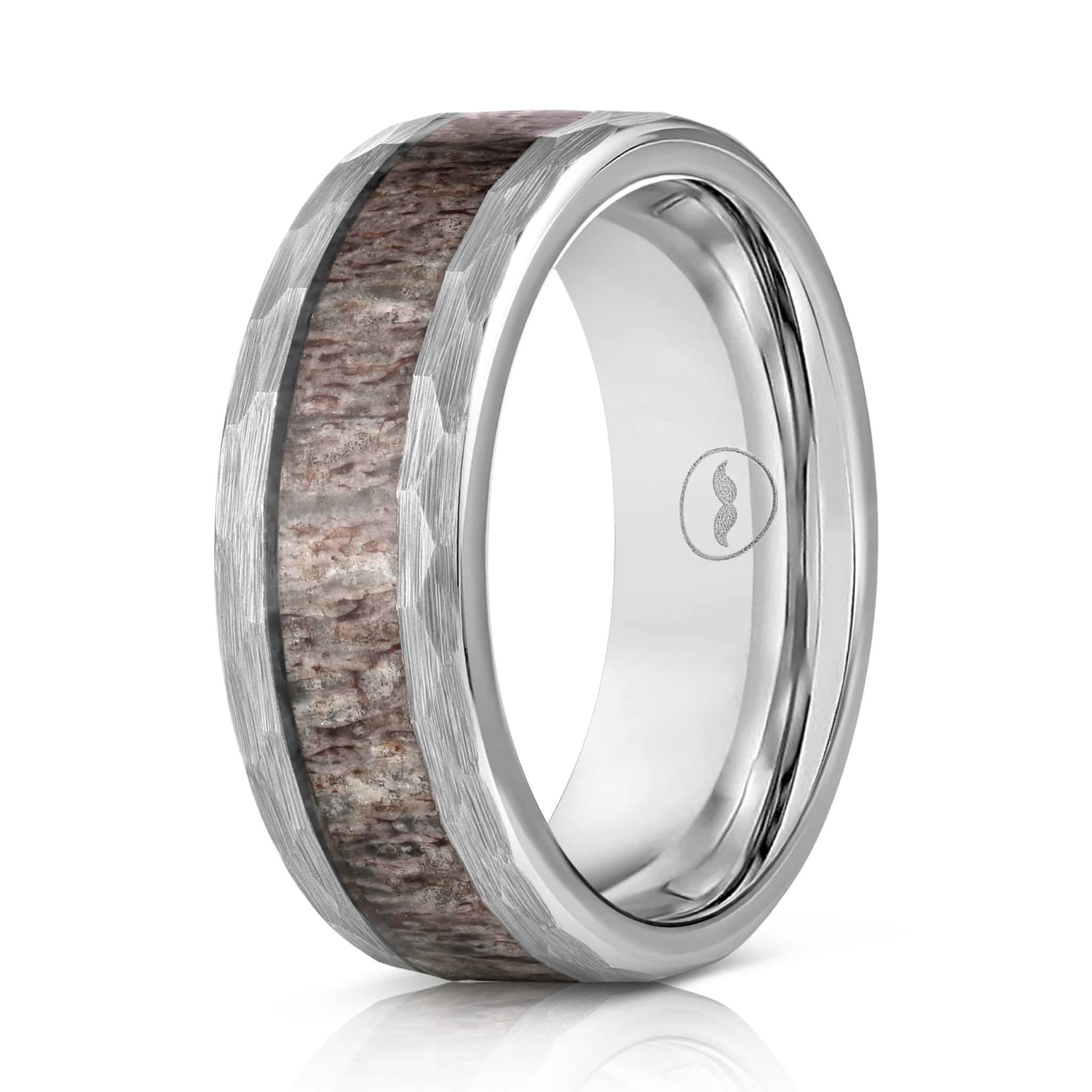 The Buck, a silver tungsten wedding band with a deer antler inlay and beveled edges, showcasing a modern yet timeless design.