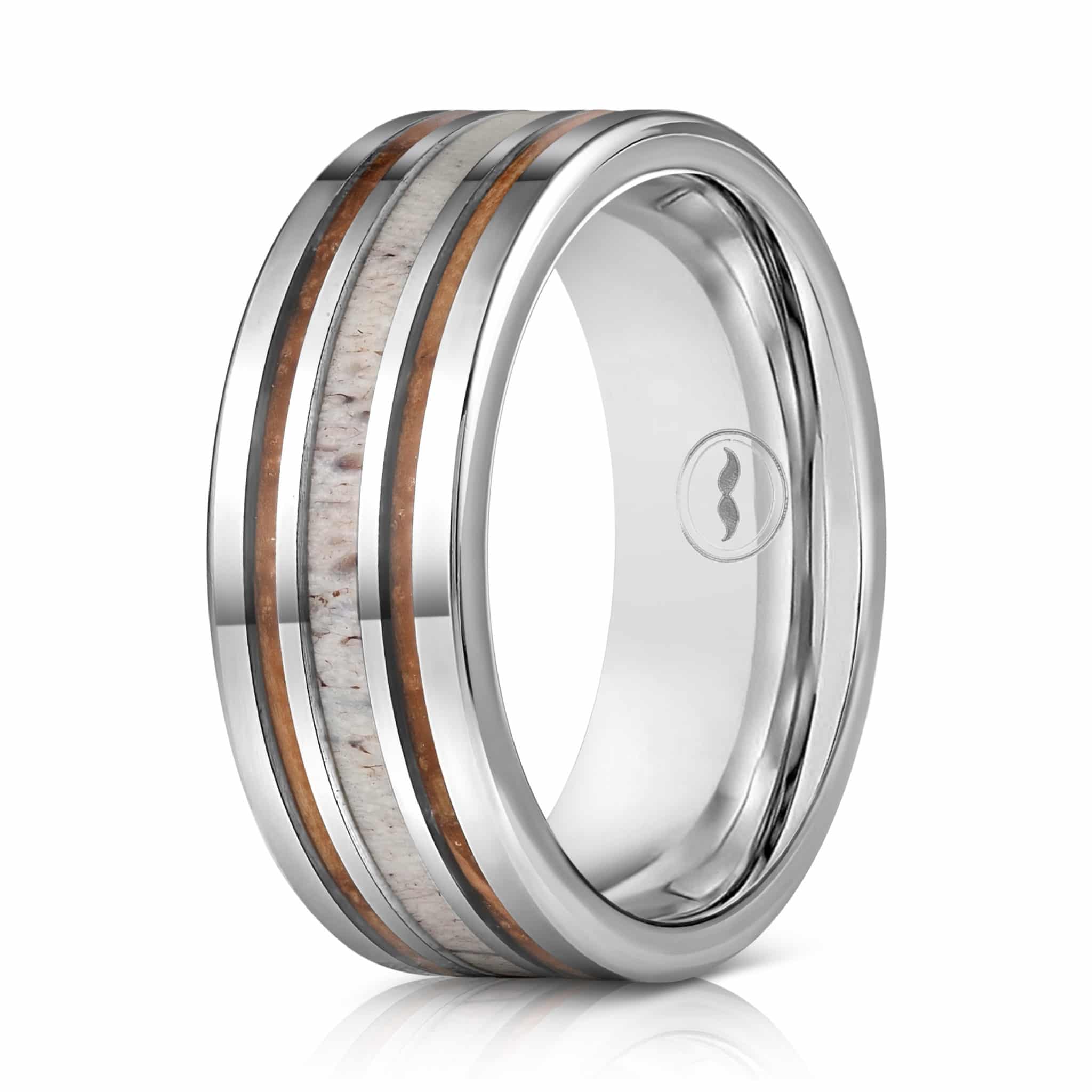 The Cowboy, a silver tungsten carbide ring that features a polished finish and Hawaiian Koa wood inlay paired with a deer antler inlay.