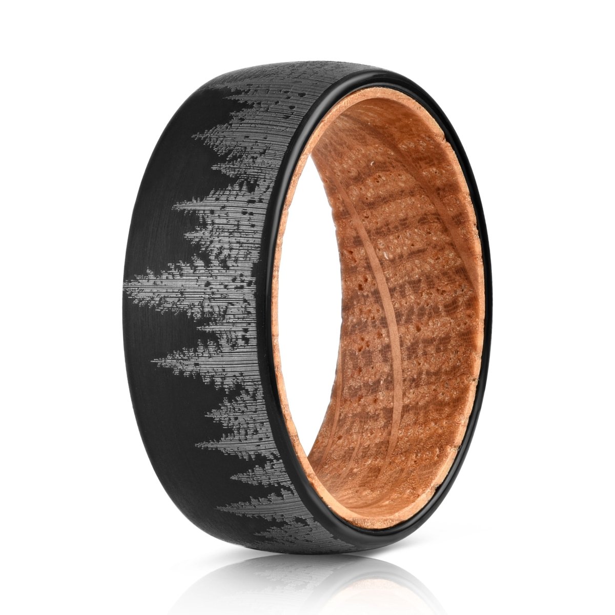 The Forest, a black tungsten ring with a brushed finish that features a laser engraved tree line and a whiskey barrel wood inner sleeve.