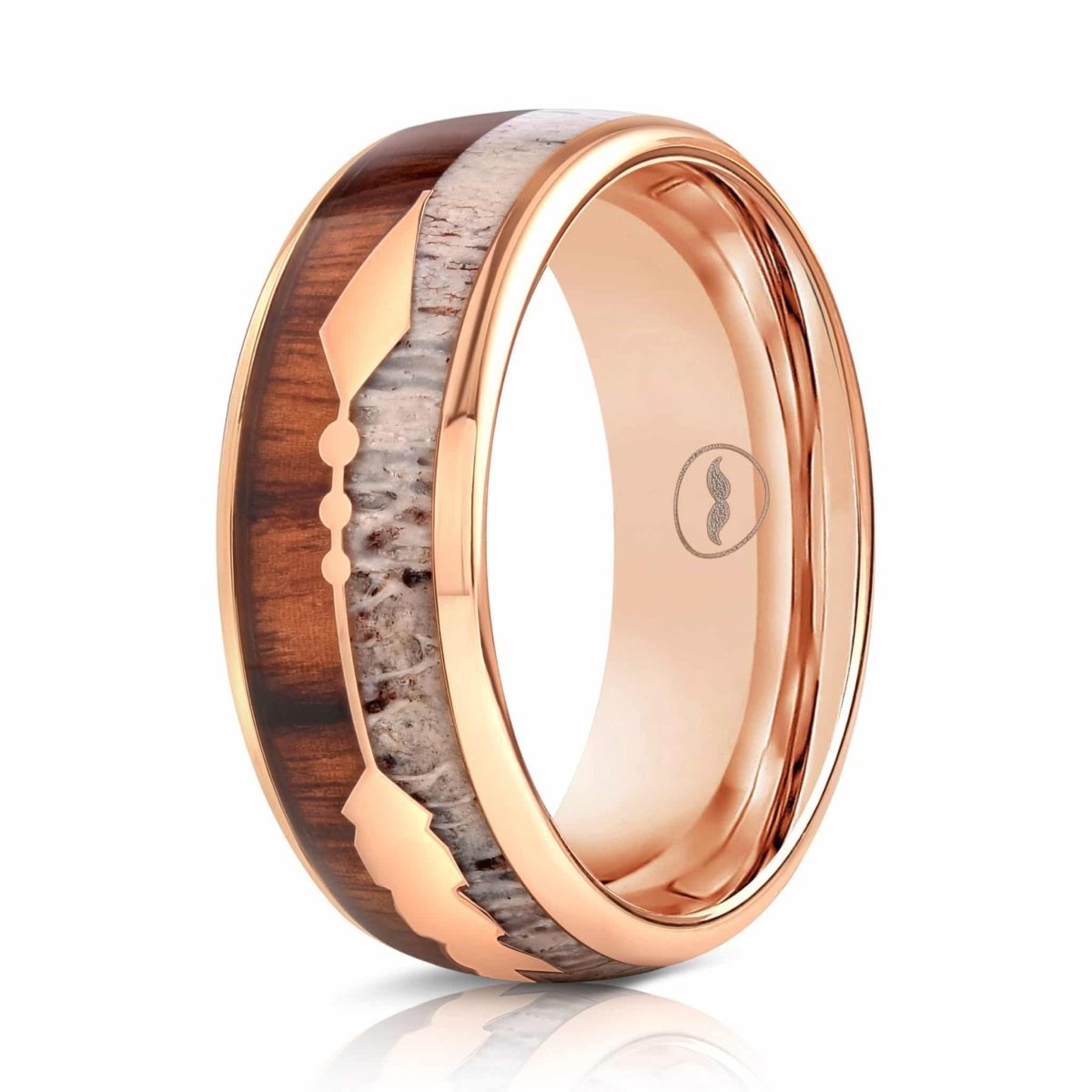 The Marksman, a 8mm rose gold silver tungsten carbide wedding band with a polished finish features a deer antler and hawaiian koa wood inlay with a center arrow design.