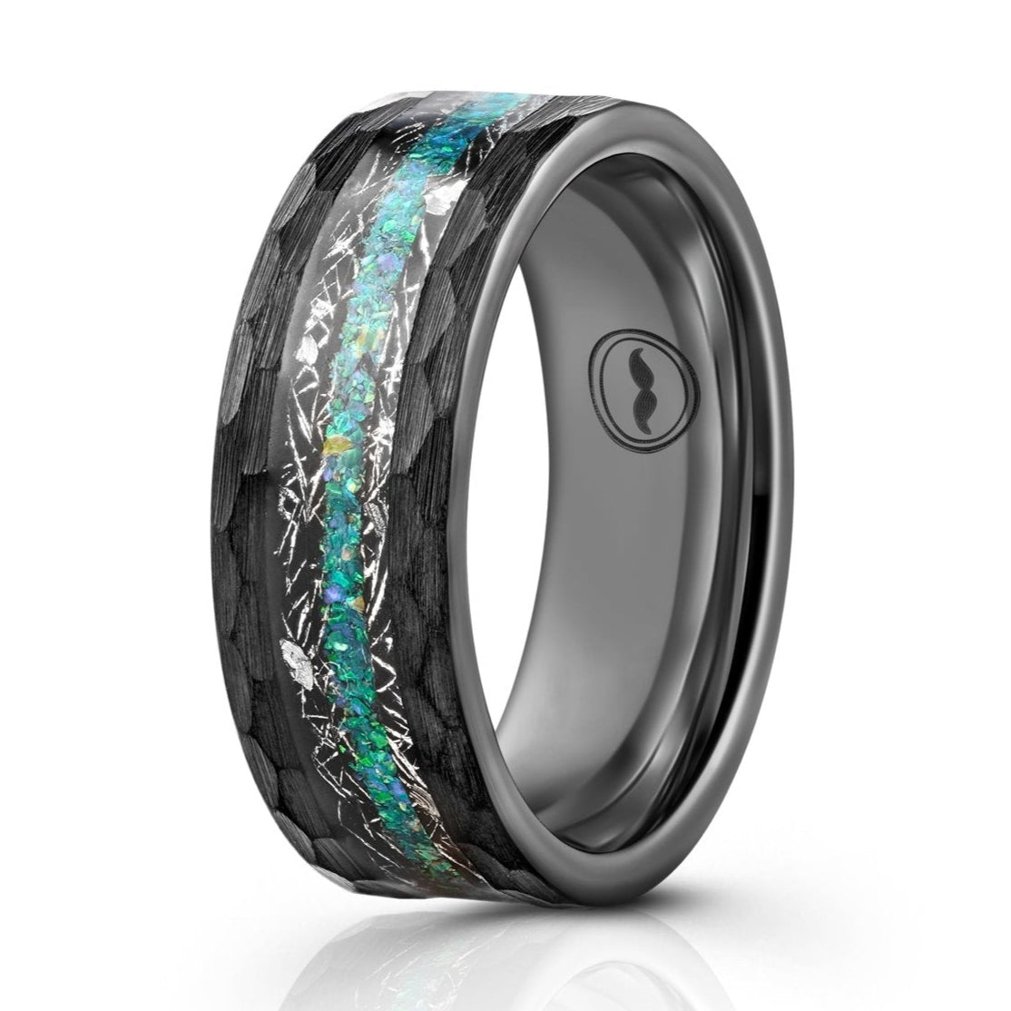 The Muonionalusta, a black tungsten carbide scratch resistant ring that features a hammered and brushed finish and a meteorite and green opal inlay.