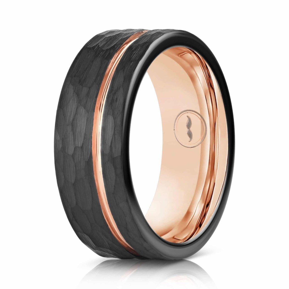 The Warrior, a black tungsten carbide scratch resistant ring that features a hammered and brushed finish with a polished rose gold groove and inner sleeve.